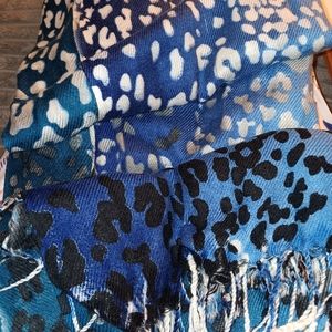 VERY SOFT AND COZY. FEELS LIKE CASHMERE  SCARF.